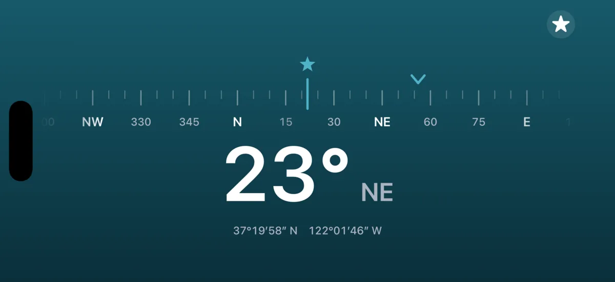 3pNorth in landscape on an iPhone, on the Petrol background: a wide heading tape, a big 23 degrees north-east, and the travel mark